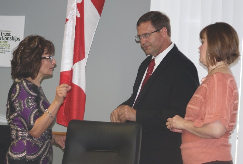Wildrose candidate Glenn van Dijken speaks to Pembina Hills Supt. Colleen Symyrozum-Watt (left) and board chair Kim Webster during the school division’s special board meeting 