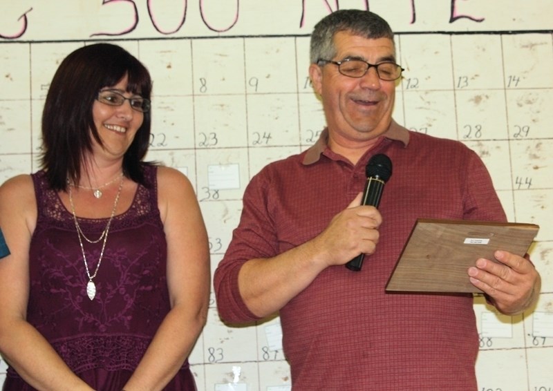 Clyde Ag Society volunteer of the year Doug Nyal (right) gives an acceptance speech on April 25 at the Ag 500. Last year’s award winner Shonda Sawchyn (left) and Darren