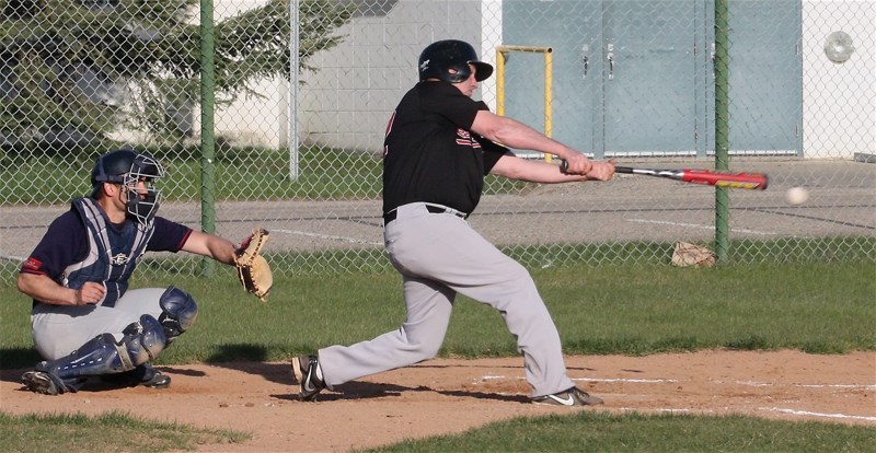 Grey Lions’ Rick Provencal makes contact during a 12-5 win over the Edmonton Blues at Keller Field on May 13.