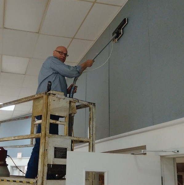 Volunteer Ted Brooks vacuums the walls of the Westlock and District Community Hall during a work bee. The hall’s new board is in the midst of freshening up the facility in