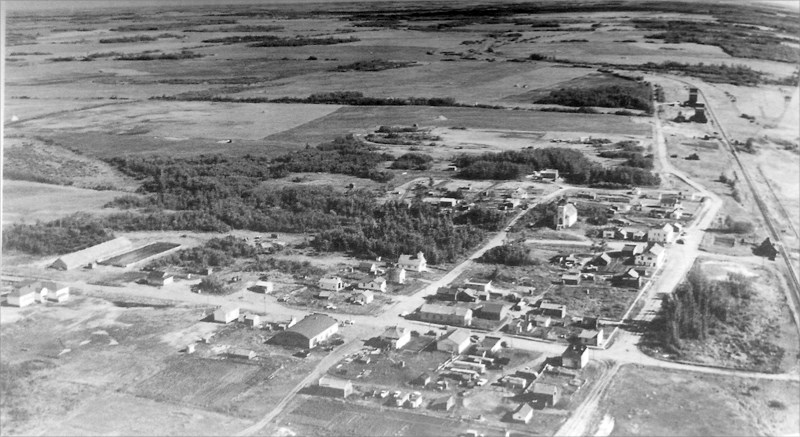 An aerial photo of Busby from 1957. In 1945, Busby had two stores, two churches, a station agent, blacksmith shop, hotel, post office, pool room and caf é.