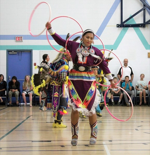 A hoop dance is performed by Naniya Cardinal, an Ojibwe-Sioux woman, with the Running Thunder Dancers. The show was part of a day of learning about First Nations culture held 