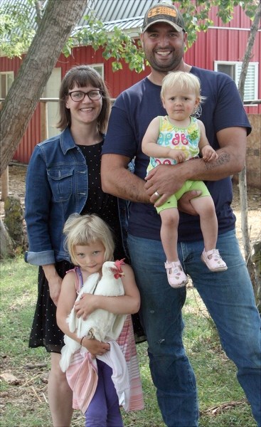 Pickardville’s 12 Acres Farm owners Jen and Brian Mendieta and their two daughters Elianna, 4, and Adelaide, 1. The Mendieta’s have partnered with 12 Acres Restaurant in St.
