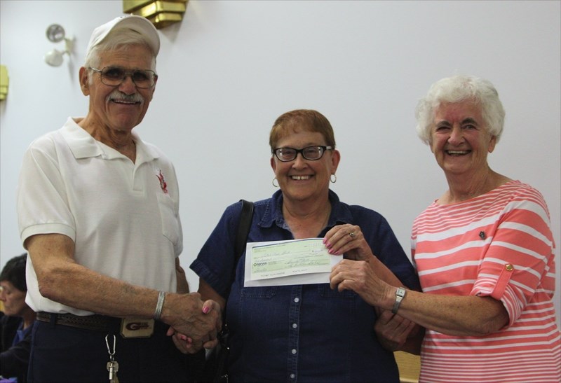 Westlock Elks rep Glen Kine (left) presents Westlock and District Food Bank president Sharon Kennedy (centre) and past president Sister Eileen Boyle with a cheque for $2,000