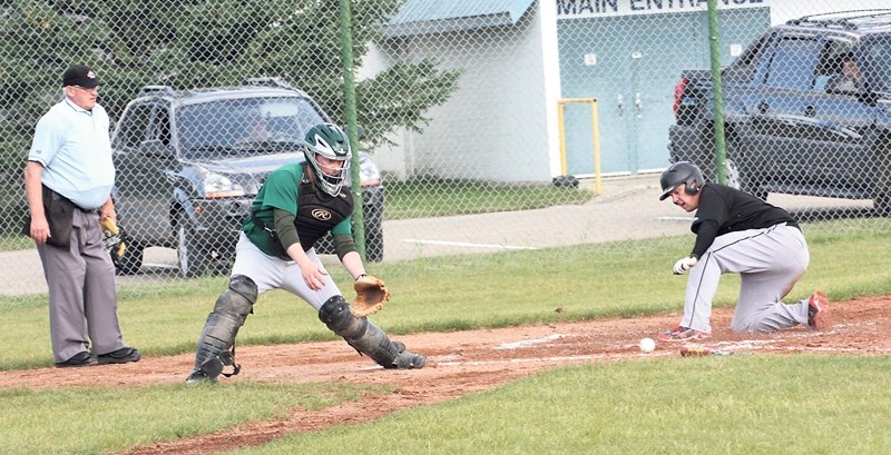 Westlock Grey Lions’ Carmen Brown slides in safely to record one of six first inning runs for the Lions during a 6-3 win at Keller Field Aug. 6.