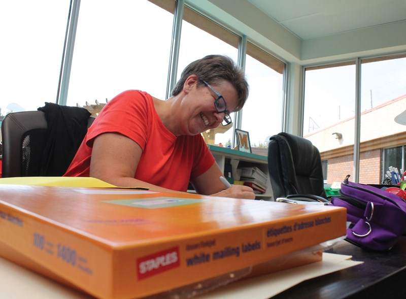 Pembina North Community School Grade 2 teacher Vicki El-Halaby prepares the newly renovated library for the coming school year. PNCS is currently undergoing significant