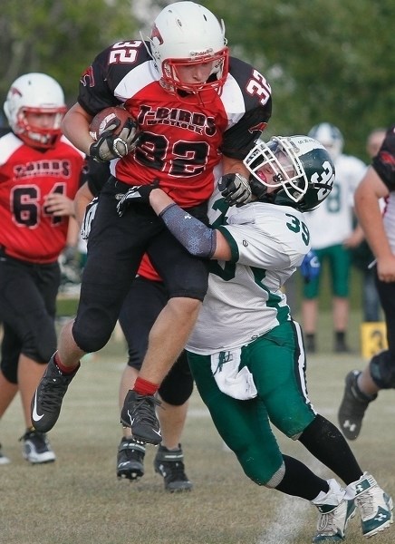 Westlock Thunderbird Robert Bokenfohr breaks a tackle during a pre-season tilt in Athabasca on Aug. 28.