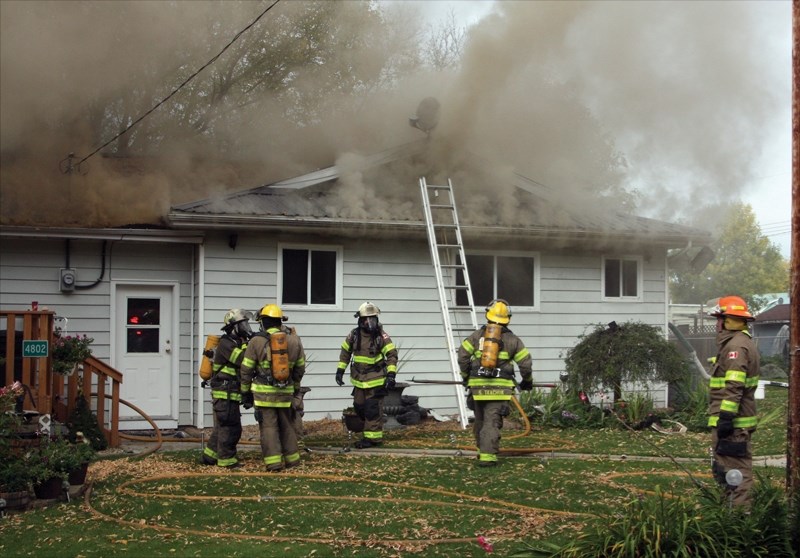 Fire crews work to extinguish a house fire in Pibroch on Sept. 19. Shortly after 10 a.m. crews were called to the scene of the fire in the south end of the hamlet. Nobody was 