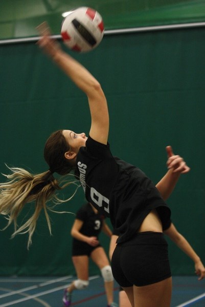 Senior T-Bird Lexi Wiese fires the ball over the net during at match at a weekend tournament in Athabasca. The girls managed a ninth place finish at the event.