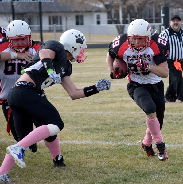 Colton Biro looks to turn the corner during the T-Birds 59-6 away loss to the St. Paul Lions in the Wheatland Football League championship semifinal on Saturday, Oct. 23.