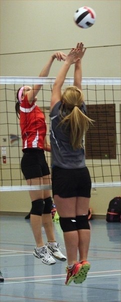 T-Bird Jyllian Fairholm tips it over the net during a game against Covenant Canadian Reformed Christian School at the Nov. 4 junior high divisional championship in Westlock.