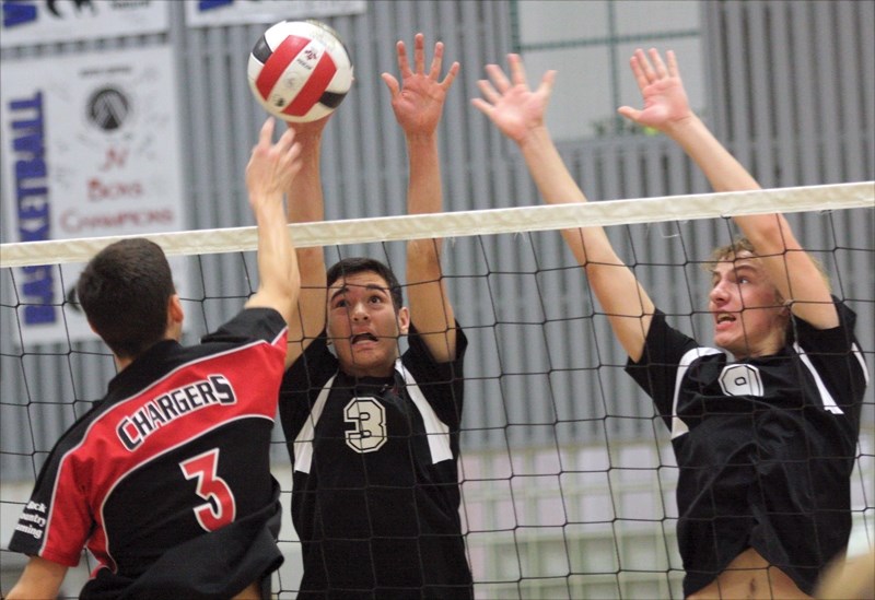 T-Birds Brent LaGlace (L) and Greg Kaliel go for a block during the club’s round-robin loss to Whitecourt Saturday at the zone championships held in Westlock.