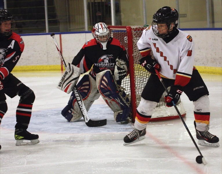 Bantam Warriors’ call-up Zac Basisty looks for a teammate during a 9-8 win over New Sarepta at the Rotary Spirit Centre on Nov. 28.