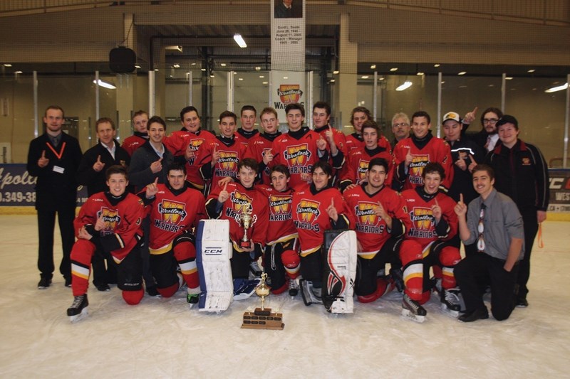 The Westlock Midget Warriors celebrate Sunday after defeating Leduc 4-1 in the final of the 11th annual Gord Smith Memorial Midget Tournament. Front row, L-R: Ryan Craig,