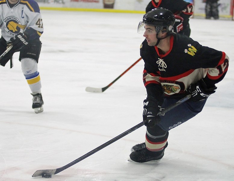 The Westlock Warriors’ losing streak reached four games following a 13-1 to the Bonnyville Pontiacs on Saturday, Dec. 12. Warrior Derek Teske carries the puck at the