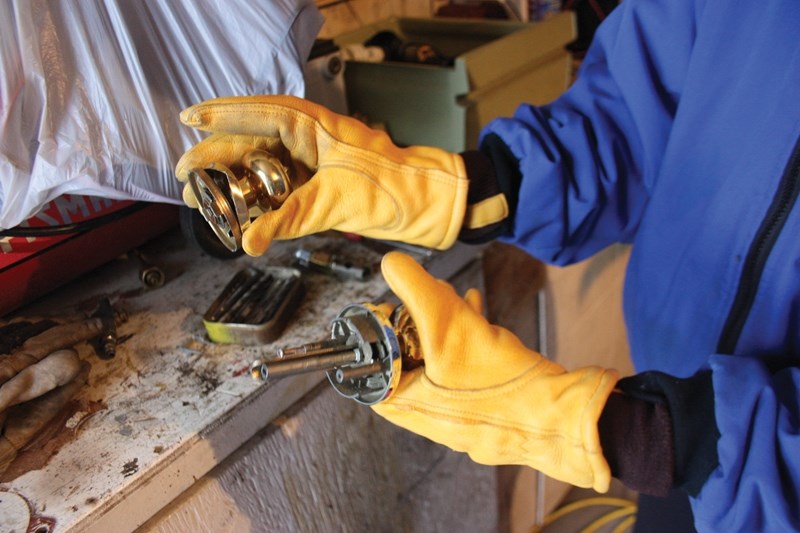 Glo Madson shows the damage done to her garage door by a burglar on Jan. 5. RCMP reported an increase in break and enters over the recent holiday season.
