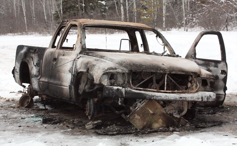 Westlock RCMP say this burned-out Dodge Dakota they found Jan. 13 in the Tawatinaw area may be connected to a pair of Jan. 12 armed robberies in Athabasca and Newbrook.