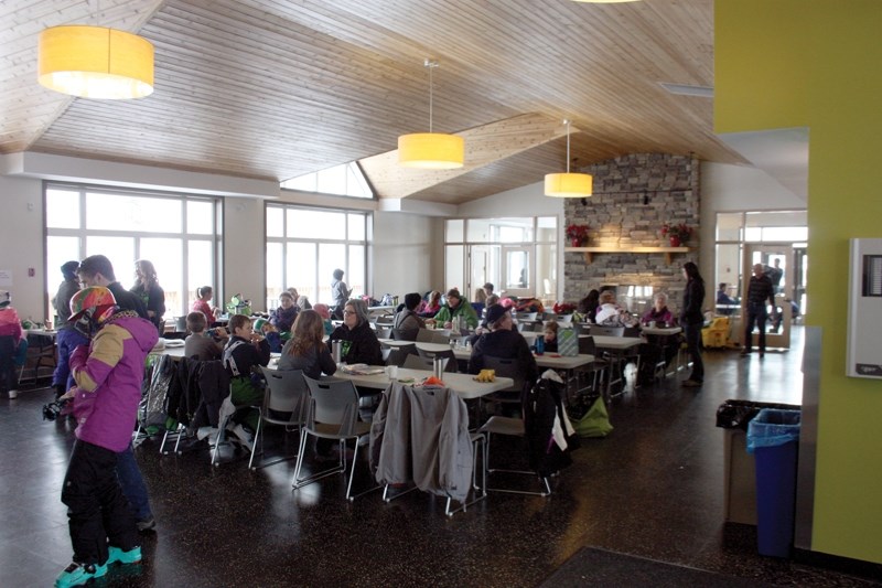Skiers and snowboarders gather to enjoy a break from the slopes at Pine Valley Resort Saturday, Jan 16. The hill is on a $2.2 million three-year lease/purchase agreement