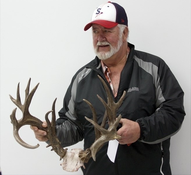 Busby hunter Richard Edwards poses with his 206 point non-typical whitetail rack at the Busby Fish and Game Association&#8217;s annual Antler Scoring and Trade Show Jan. 30