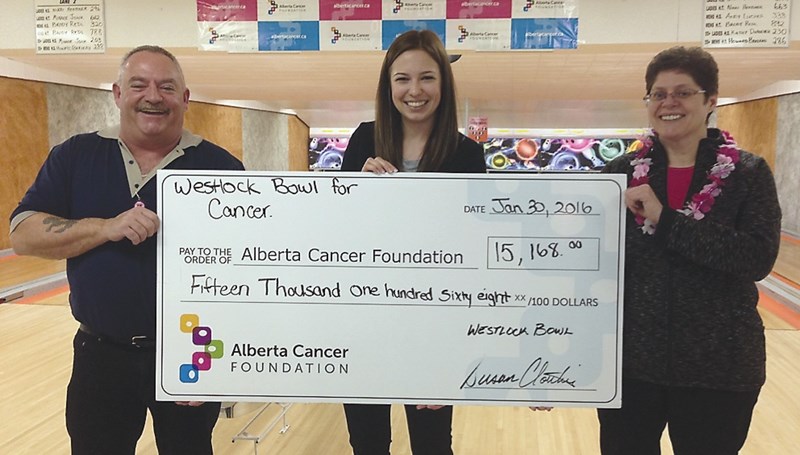 L-R: At the conclusion of the fifth annual Bowl For Cancer event Jan. 31 Westlock Bowl owner Don Cloutier, Alberta Cancer Foundation employee Amie St. Arnaud and Westlock
