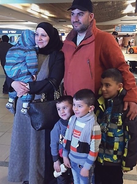 Westlock’s newest residents arrived at Edmonton International Airport on Saturday, Feb. 6. Pictured is Yasmeen Al Masalmeh (left) holding one-year-old Abdullah Al Akrad,