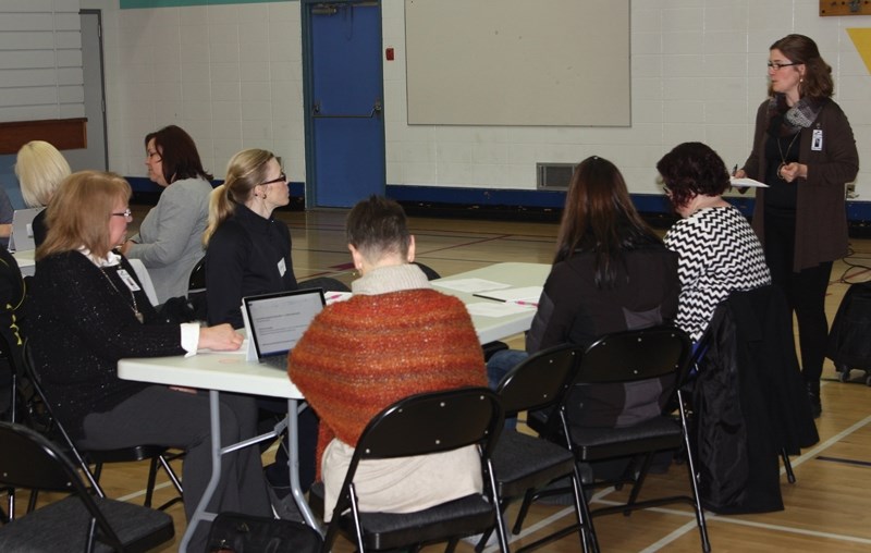 Pembina Hills board chair Jennifer Tuininga, far right, addresses the 15 or so parents and community members who showed up for a public meeting at Westlock Elementary School