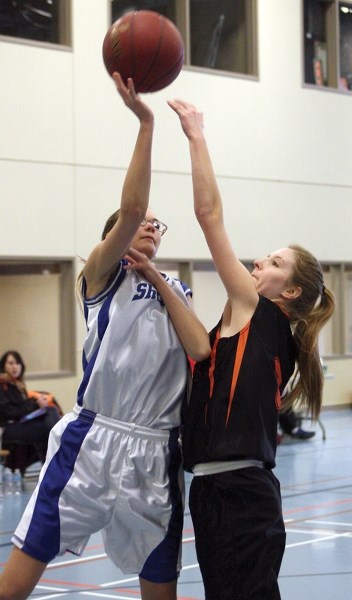 St. Mary Shark Jenna Schwarz lets go of a shot during a 54-25 loss to the Hay Lakes Tigers during 2016 Cathy Mitchell Cup action at the Rotary Spirit Centre on Saturday, Feb. 
