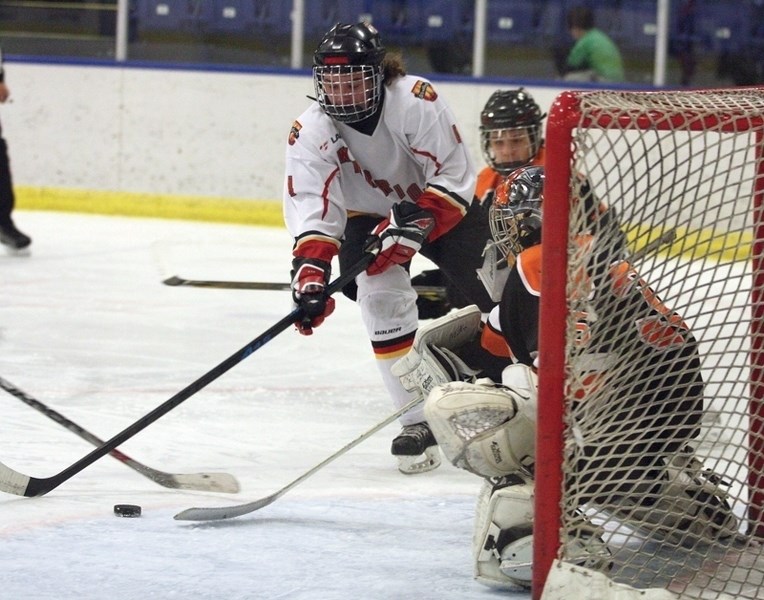 Pee wee 1 Warrior Jaxson Snow puts his team ahead 2-1 during Game 1 of the best-of-three 1660 Tier 2 Hockey League final against the CR Knights at the Rotary Spirit Centre on 