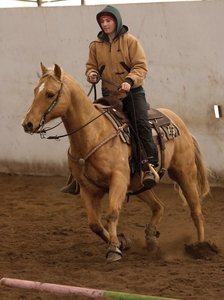 Lilly Artemenko takes a run on her horse Peppy during a practice riding session at the Hazel Bluff Quarter Horses riding stable, north of Hazel Bluff Community Hall.