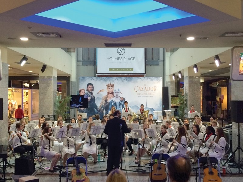 t. Mary School’s music teacher Oscar-Jose Garcia leads the senior wind ensemble during a 90-minute performance at a shopping mall in Madrid during the band’s 11-day trip to