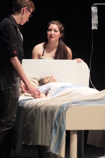 Ryan Barlow (left) and Holly Roberts act out a scene in the play Locked In during a night of one-act plays at CATS Theatre on April 19.