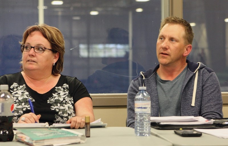 New minor hockey association president Rick Dutchak (left) listens alongside Shelly Chamzuk at the association’s annual general meeting at Rotary Spirit Centre April 20.