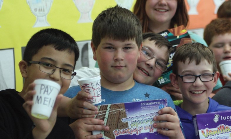 L-R: Westlock Elementary School Grade 6 students Amin Abdumuminov, Ethan Legault, Jode Clements and Matthew Arndt prep supplies for their week-ending ice cream sale. May 4,