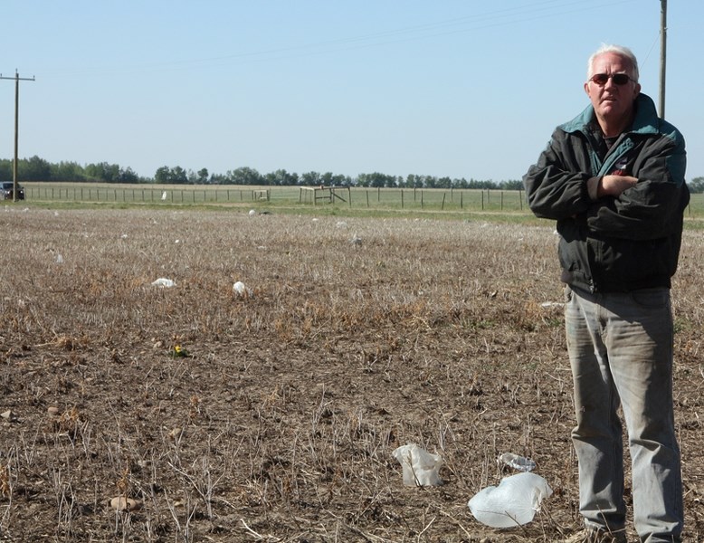 Farmer Nick Jonk is calling on the Town of Westlock to help him clean up garbage scattered through his field.