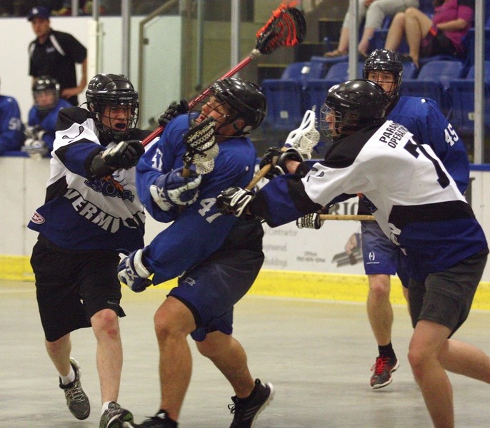 Westlock Junior Rock’s Scott Ivey drives through a pair of Vermilion Roar defenders during a 7-2 home win on Sunday, May 15 at the Rotary Spirit Centre. The Rock also picked