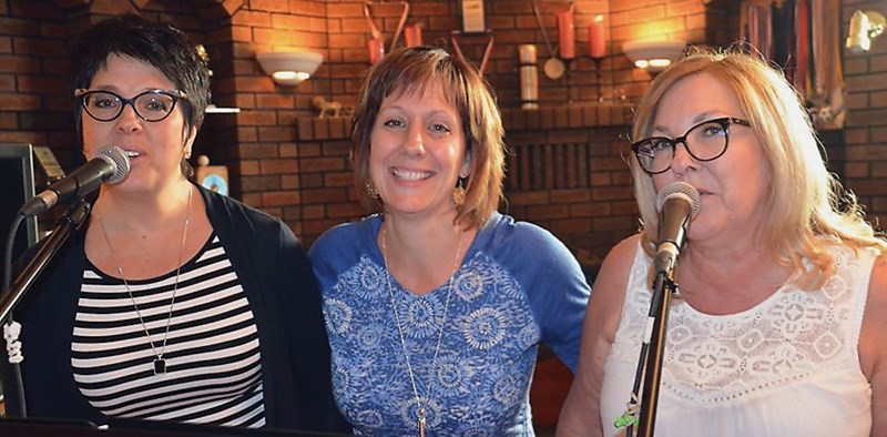 Westlock-area rock band Sable Ridge are reuniting for a special homecoming show. Pictured are Julia Walker, Sandy Johnston, and Rose Bain during a recent practice session.