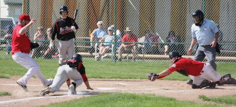 Patrick Rains makes it home safe during the Red Lions 19-0 victory over the Camrose Axemen in the second game of their double-header at Keller Field June 19.
