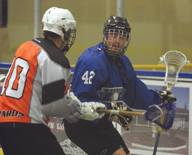 Westlock Junior Rock’s Jake Chizma looks for an open teammate during a 12-3 thrashing of the North Edmonton Wizards at the Rotary Spirit Centre on June 17. The club finished