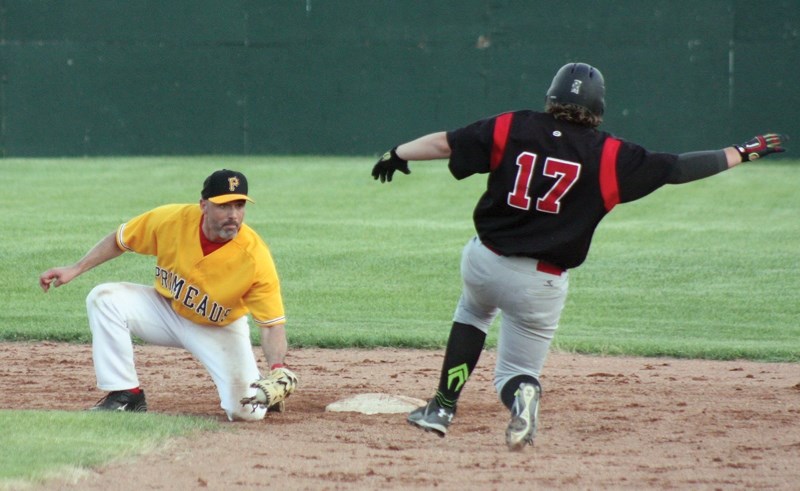 Westlock Red Lions’ Ryley Evison slides into second during a match up against the Edmonton Primeaus at Keller Field on Saturday, July 2 during the John Golonowski