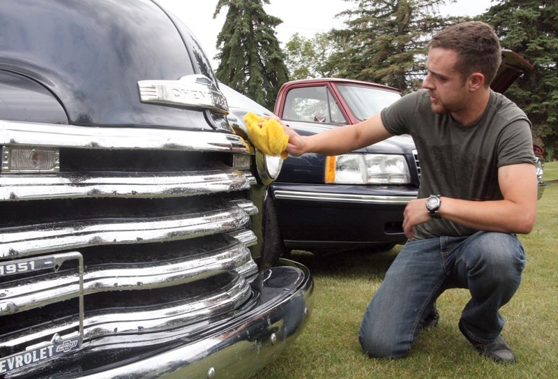 Dustin Jamieson shines the grill of his 1951 Chevrolet 3100 at the 29th annual Westlock Wheels of Class Show N’ Shine at Lindhal Park on July 10. About 200 car enthusiasts