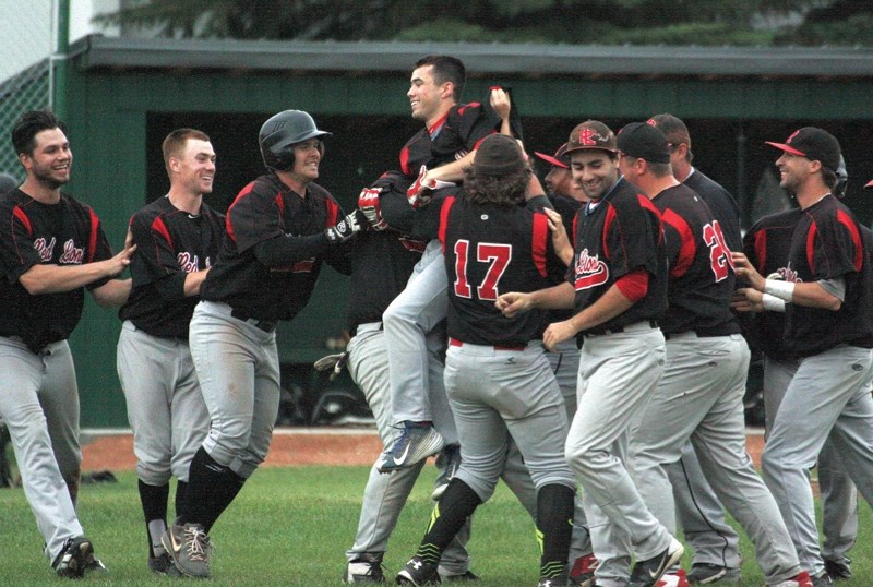 The Westlock Red Lions hoist Austin Watamaniuk after he batted in the winning run in the club’s 3-2 victory over the Edmonton Blackhawks July 6 at Keller Field. The win puts