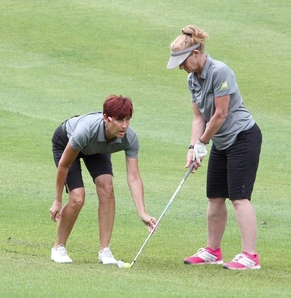 Johanna Camarta lines up for a shot with help from coach Darlene Smith with competing in the Canadian Blind Open at the Westlock Golf Course on July 11.