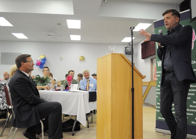 Wildrose leader and Fort McMurray-Conklin MLA Brian Jean speaks to supporters, including local MLA Glenn van Dijken (left), at Memorial Hall July 28. The