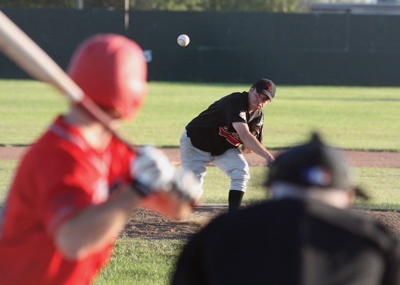 Westlock Grey Lions’ Ryan Rau serves up a pitch during a 14-4 win over the Edmonton Heat at Keller Field on Monday, July 25. The Grey Lions will begin AWCBA playoffs with a