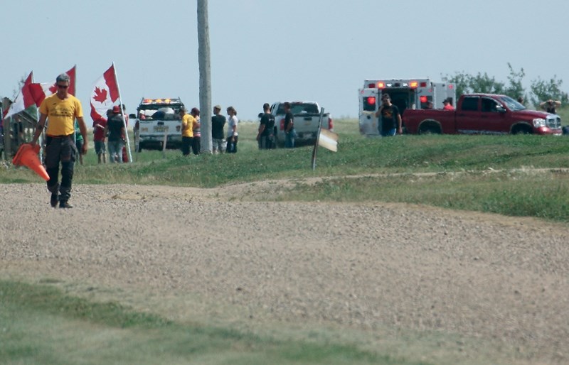 Emergency crews treat a fatally injured skydiver at the Edmonton Skydive Centre at the Westlock Municipal Airport on Aug. 14. A 52-year-old man was unable to land properly