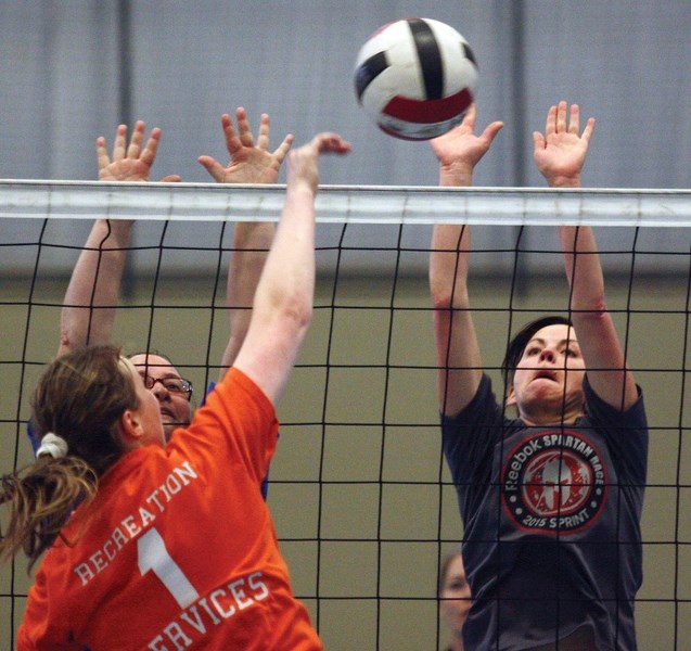 Current R.F. Staples senior girls volleyball coach Delia Carlson goes up for a block during the school&#8217;s alumni tournament held Sept. 17 at the Rotary Spirit Centre.