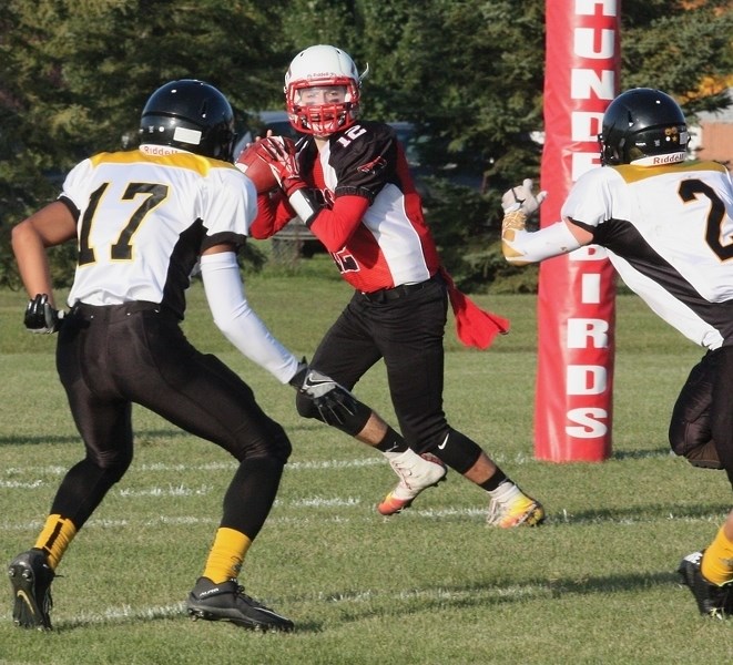 Westlock Thunderbird quarterback Curtis Vesely looks down field for a receiver during a 41-21 Friday night home loss to the Cold Lake Royals. Next up for the T-Birds is a