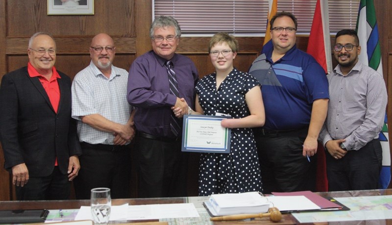 Town of Westlock councillors presented local CHAMP Sawyer Dutka with a certificate of recognition at their Sept. 26 meeting. L-R: Clem Fagnan, Wyatt Glebe, John Shoemaker,