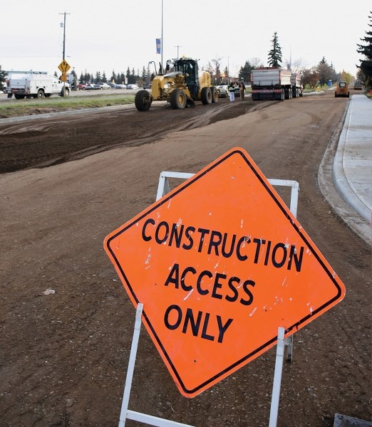 Road crews finish up the last legs of the Southview area road, water and sewer system rehabilitation. The $5.1 million project is on track for com-pletion by the end of the