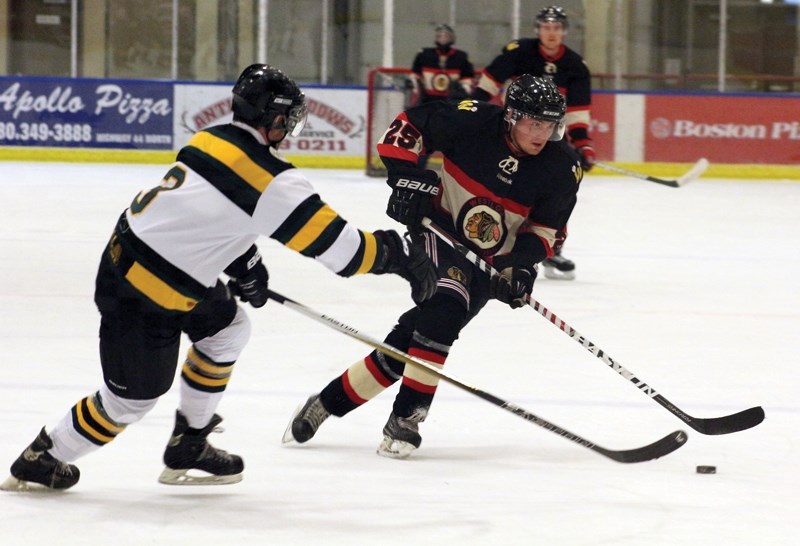 Senior Warriors’ Jorrey Jensen takes the puck to the net during a 7-6 Oct. 8 exhibition home loss to the Grande Prairie Athletics.